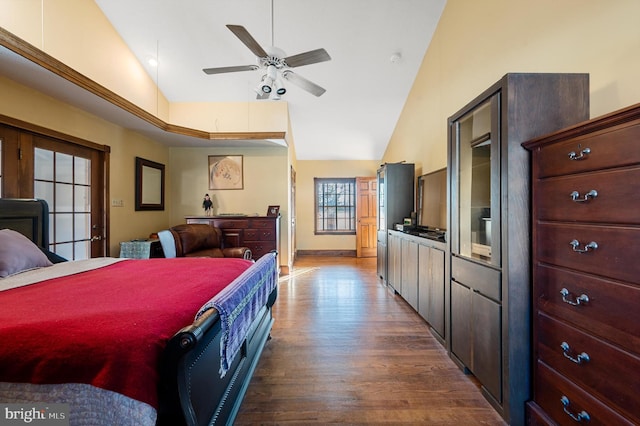 bedroom with hardwood / wood-style flooring, high vaulted ceiling, and ceiling fan