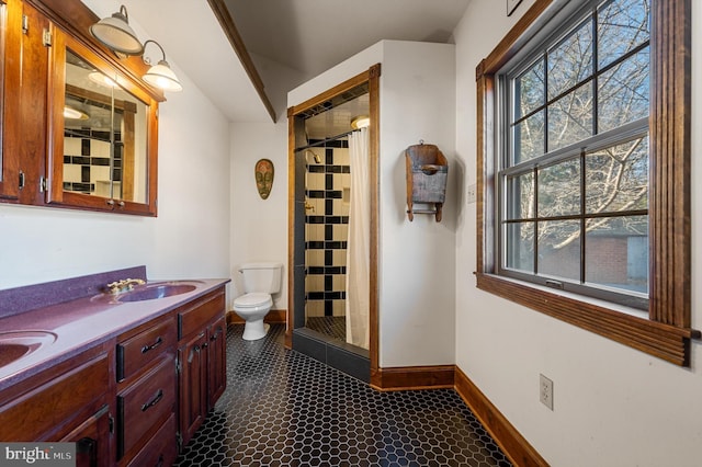 bathroom featuring tile patterned flooring, vanity, toilet, and a shower with shower curtain