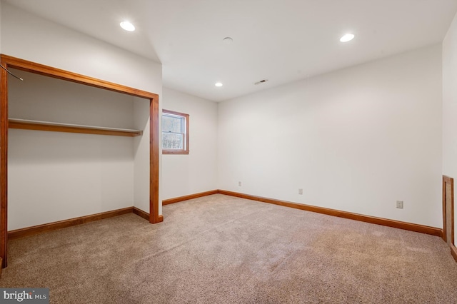 unfurnished bedroom with carpet floors and a closet