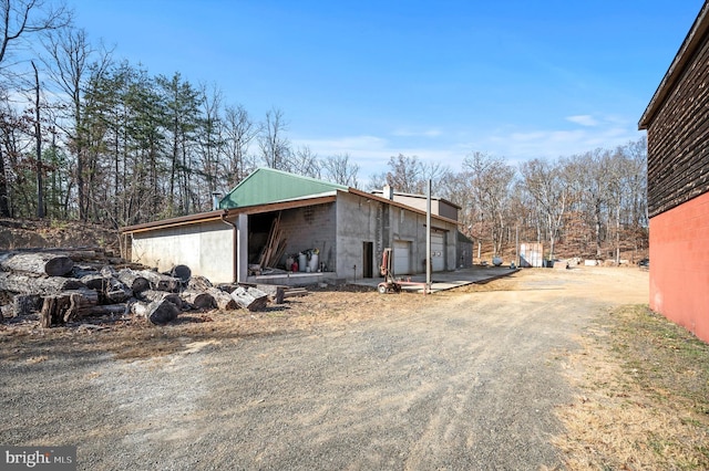 view of side of home with a garage