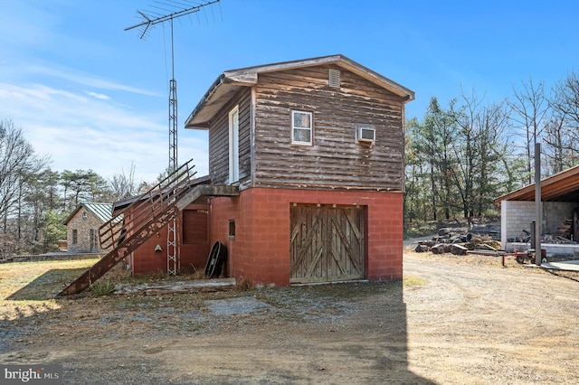 view of property exterior featuring a garage