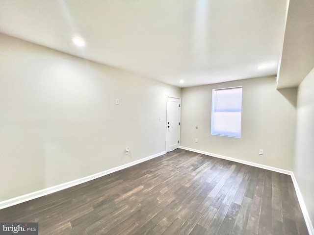 empty room with dark hardwood / wood-style floors