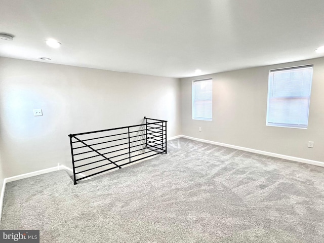 basement with carpet flooring and a healthy amount of sunlight