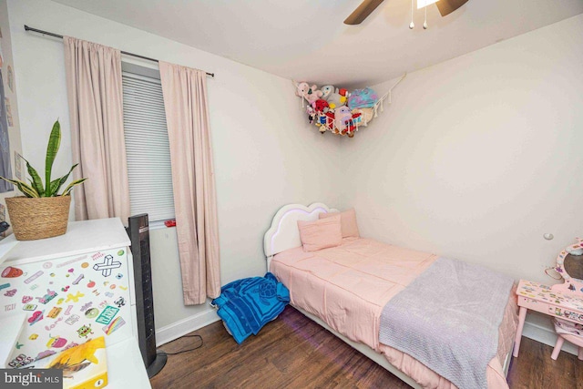 bedroom featuring ceiling fan and dark wood-type flooring