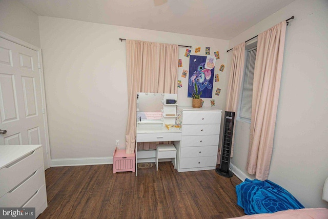 bedroom with dark hardwood / wood-style flooring