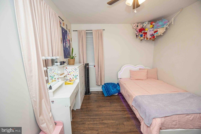 bedroom featuring ceiling fan and dark hardwood / wood-style flooring