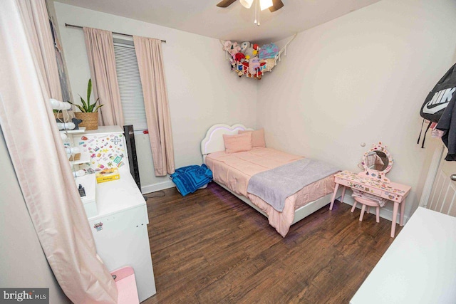 bedroom featuring dark hardwood / wood-style flooring and ceiling fan