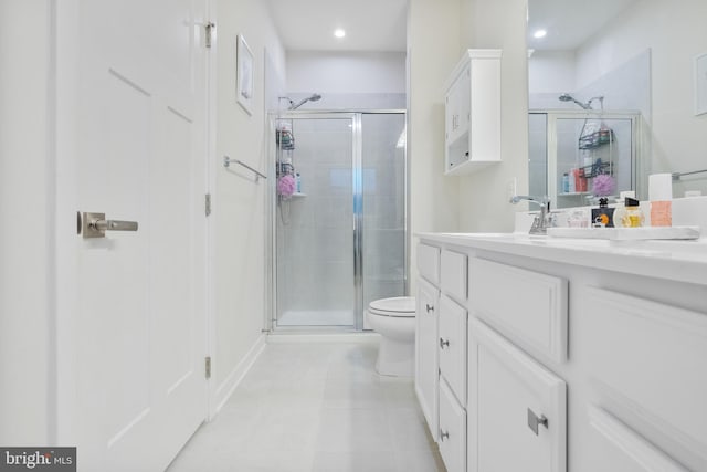 bathroom featuring tile patterned flooring, vanity, an enclosed shower, and toilet