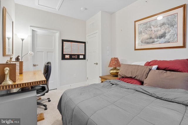 bedroom featuring light carpet