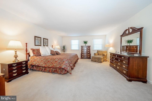 bedroom featuring light carpet