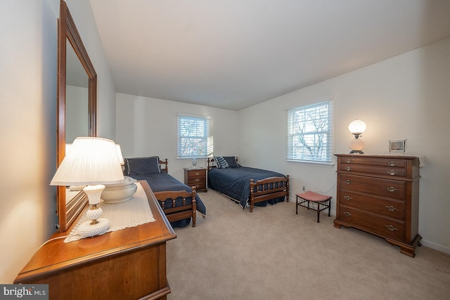 bedroom featuring light carpet