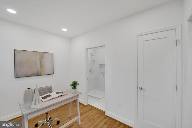 home office with hardwood / wood-style floors