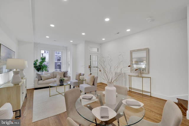 living room with light hardwood / wood-style flooring