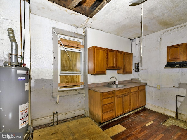 kitchen with sink, dark hardwood / wood-style floors, and water heater