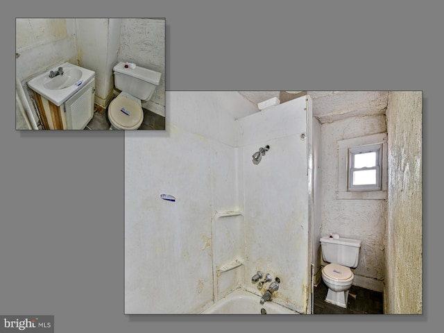 full bathroom featuring sink, bathtub / shower combination, and toilet