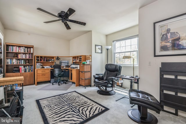 office space featuring ceiling fan and light carpet