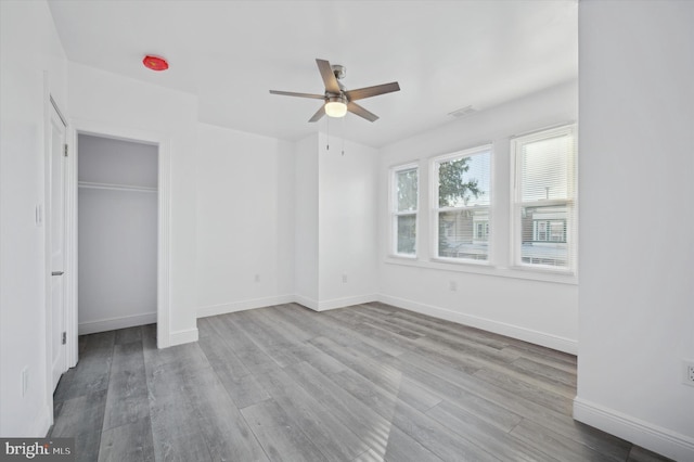 unfurnished bedroom featuring light hardwood / wood-style floors and ceiling fan