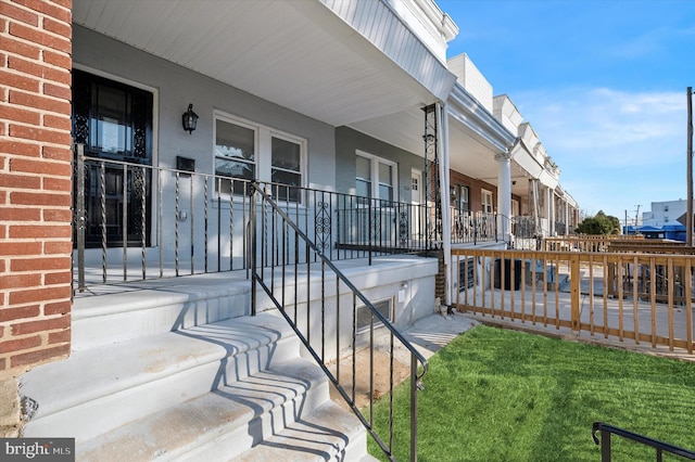 entrance to property with covered porch