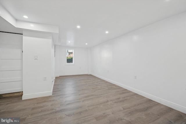 empty room with light hardwood / wood-style floors