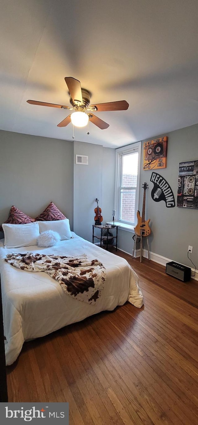 bedroom featuring hardwood / wood-style flooring and ceiling fan