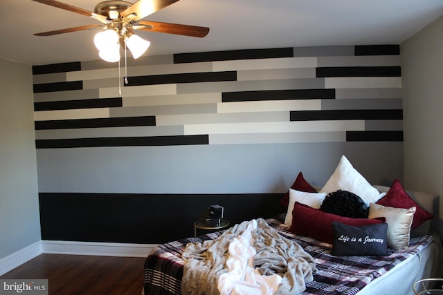 unfurnished bedroom featuring dark hardwood / wood-style flooring and ceiling fan