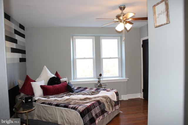 bedroom with dark hardwood / wood-style flooring