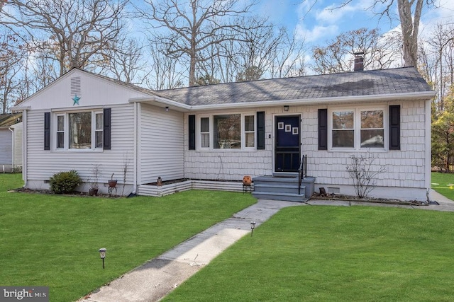 ranch-style home featuring a front yard