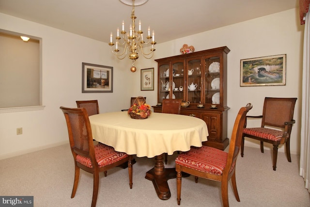 carpeted dining area with a notable chandelier