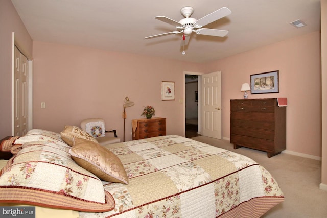 carpeted bedroom with ceiling fan