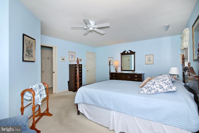 bedroom featuring ceiling fan and light carpet