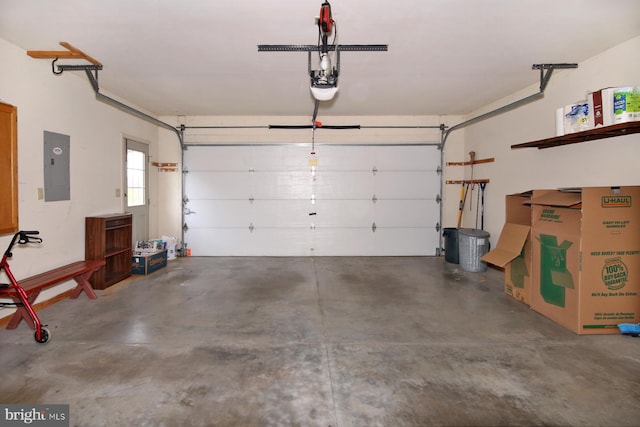 garage with electric panel and a garage door opener