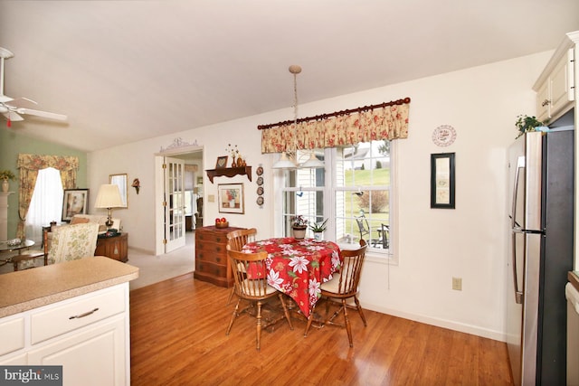 dining area featuring ceiling fan and light hardwood / wood-style flooring