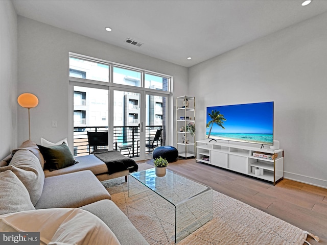 living room with light hardwood / wood-style flooring