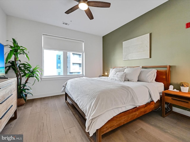 bedroom featuring ceiling fan and light hardwood / wood-style floors