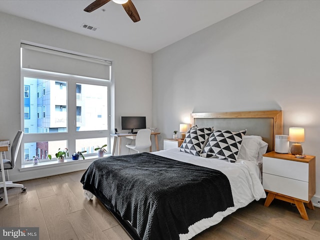 bedroom featuring ceiling fan and light hardwood / wood-style floors