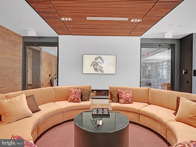 living room with wooden walls