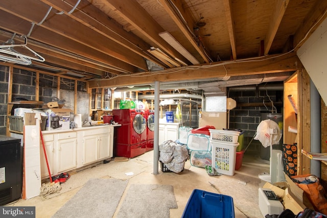 basement with washing machine and clothes dryer