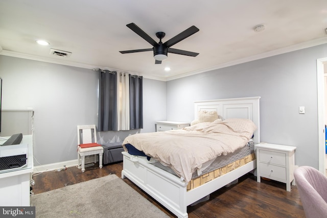 bedroom featuring ceiling fan, crown molding, and dark wood-type flooring