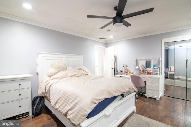 bedroom with ceiling fan, ornamental molding, dark wood-type flooring, and a closet