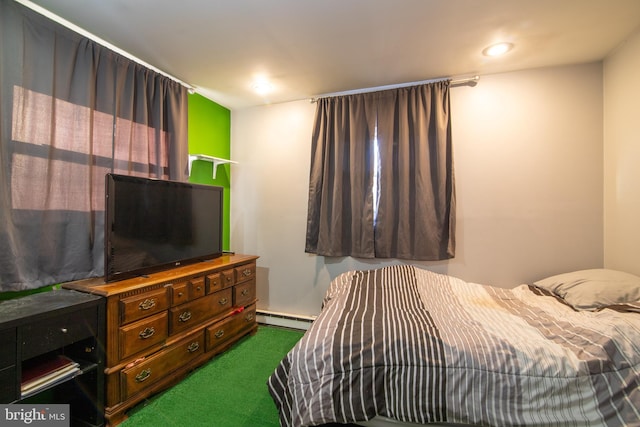 carpeted bedroom with a baseboard radiator