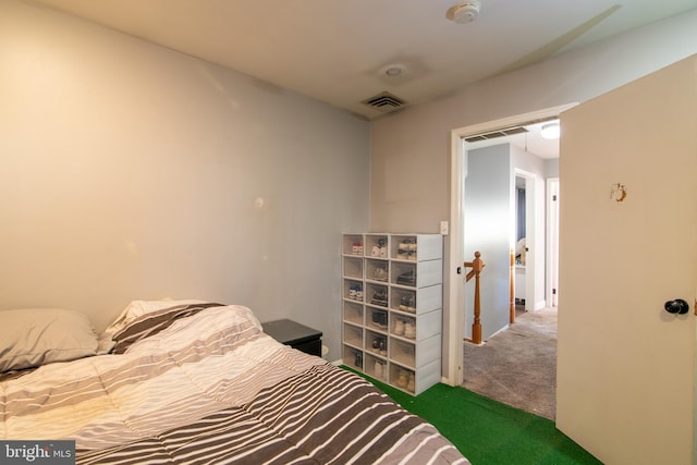 bedroom featuring dark colored carpet