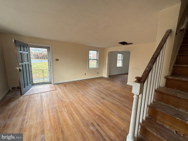 interior space featuring hardwood / wood-style flooring and a wealth of natural light