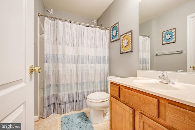 full bathroom featuring toilet, vanity, tile patterned floors, and shower / tub combo with curtain