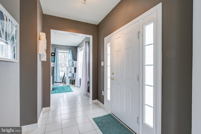 entryway featuring light tile patterned flooring