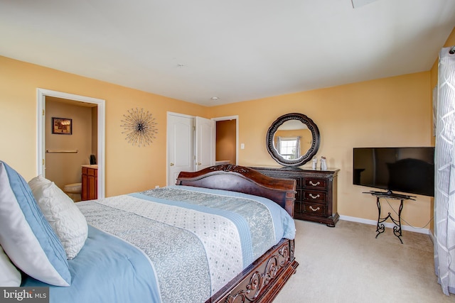 carpeted bedroom with ensuite bathroom