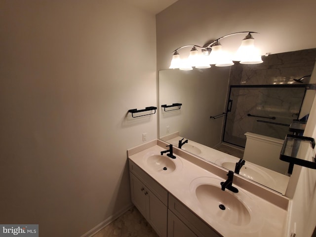 bathroom with vanity and a shower with shower door