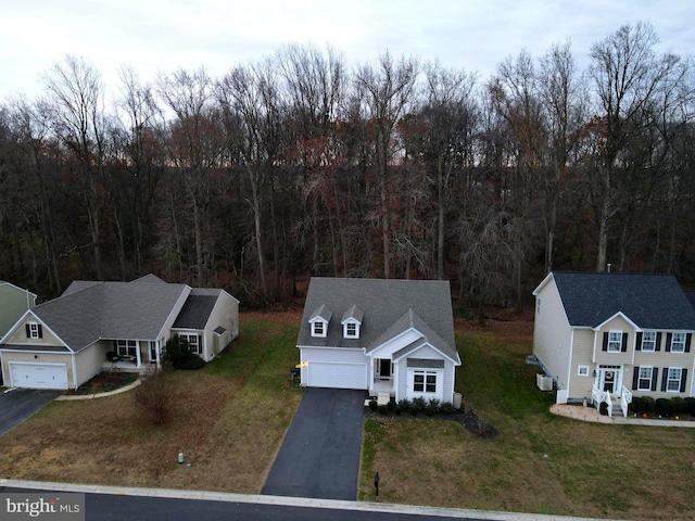 aerial view featuring a wooded view