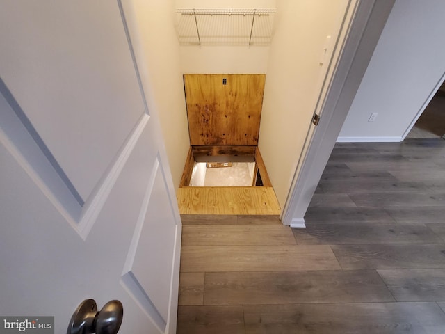 stairway featuring hardwood / wood-style flooring