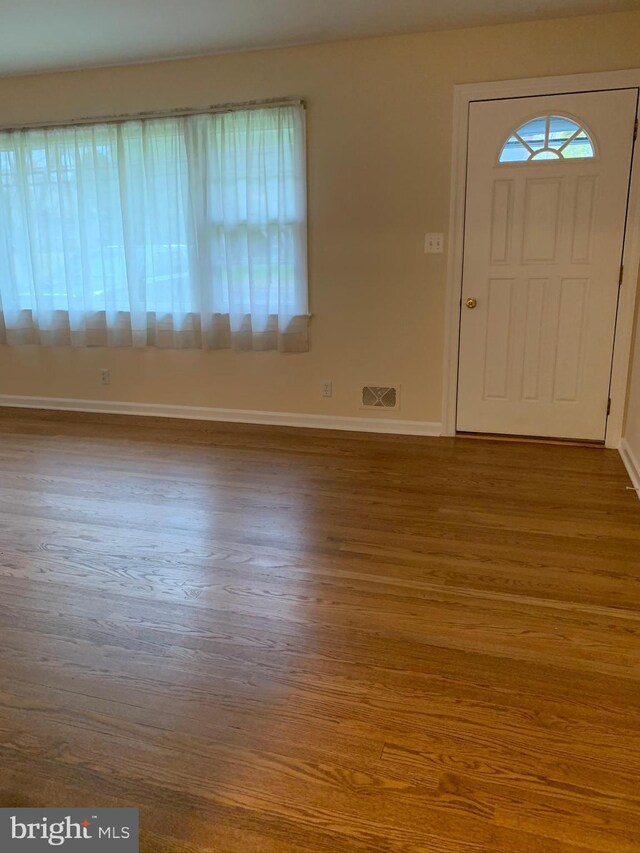 foyer entrance featuring hardwood / wood-style floors