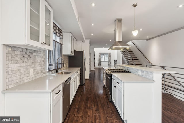 kitchen with sink, stainless steel appliances, dark hardwood / wood-style floors, island range hood, and white cabinets